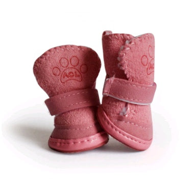 Pair of pink dog boots with paw print design on a white background. Bishop X 