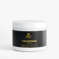 Colostrum powder in a clean, minimalist container. Bishop Elite Supplements 