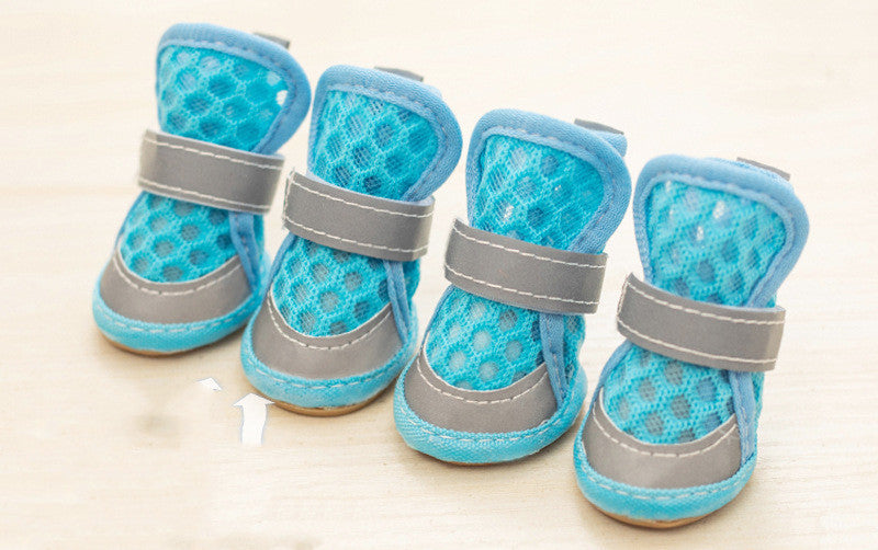 Set of four blue pet boots with gray straps on a light background. Bishop X 