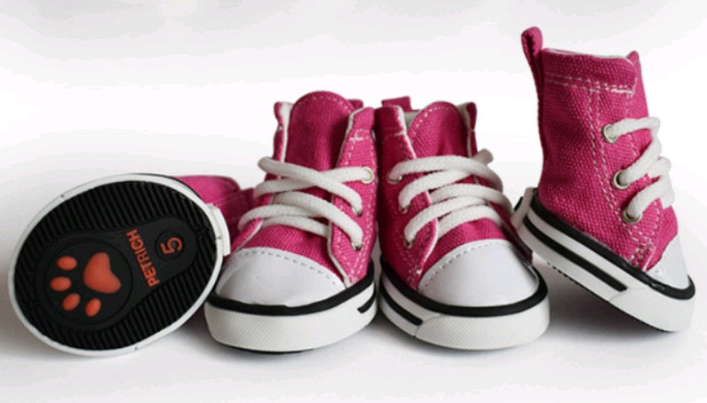 Pink high-top sneakers with white laces on a white background. Bishop X 