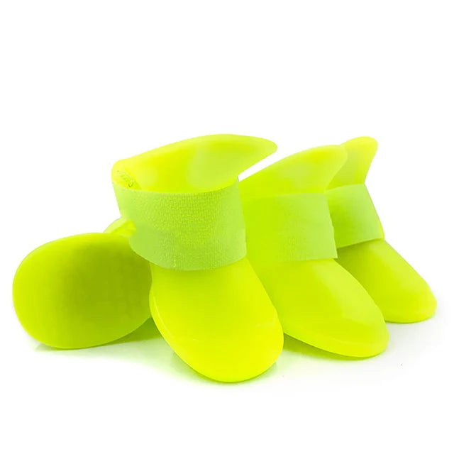 Four bright yellow dog boots on a white background . Bishop x 