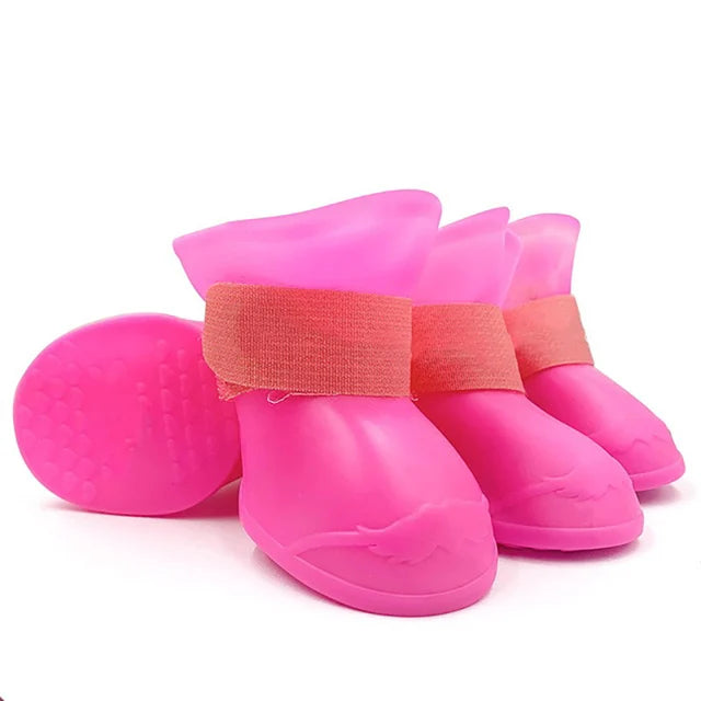 Pink pet rain boots with a strap on a white background. Bishop x 