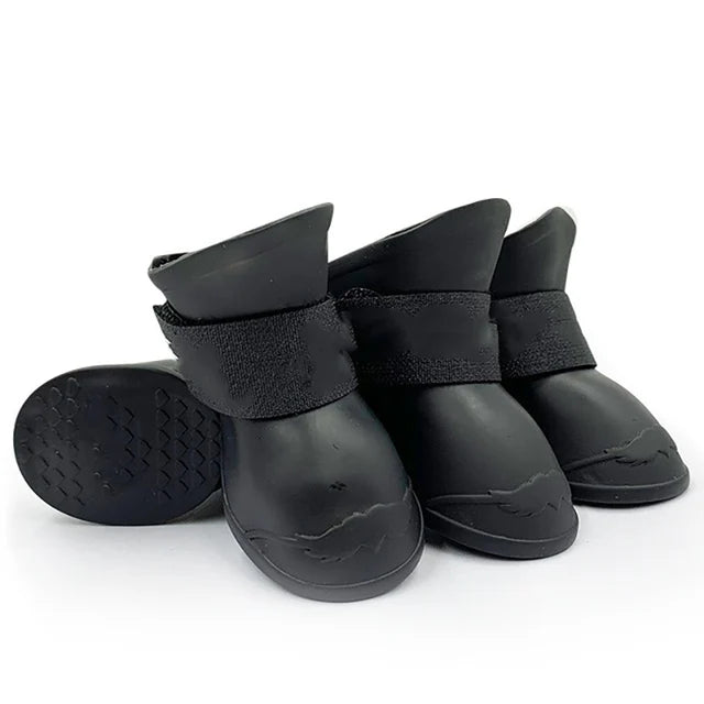 Set of black rubber boots with adjustable straps on a white background . Bishop x 