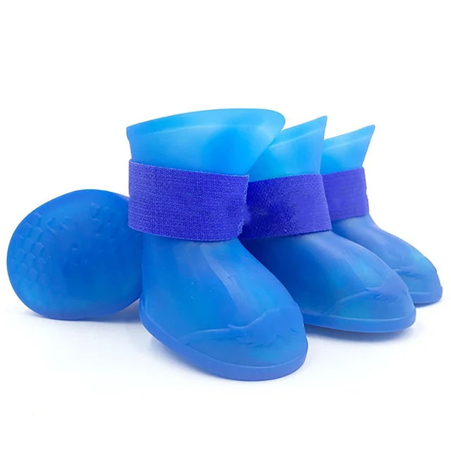 Set of blue pet rain boots with purple straps on a white background. Bishop x 