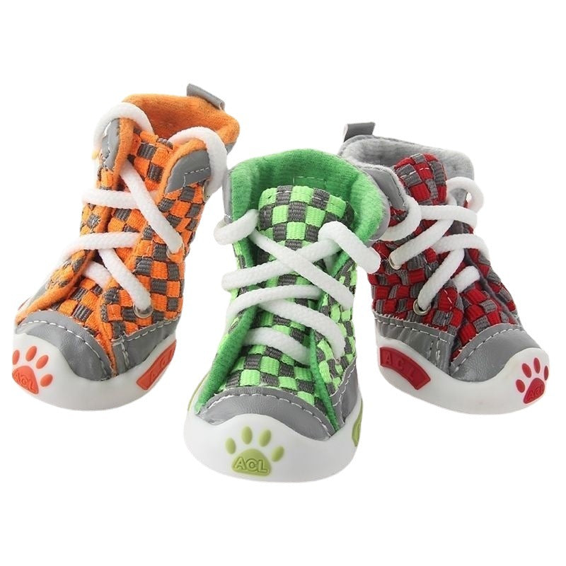 Three colorful children's shoes with paw prints on a white background. Bishop X 