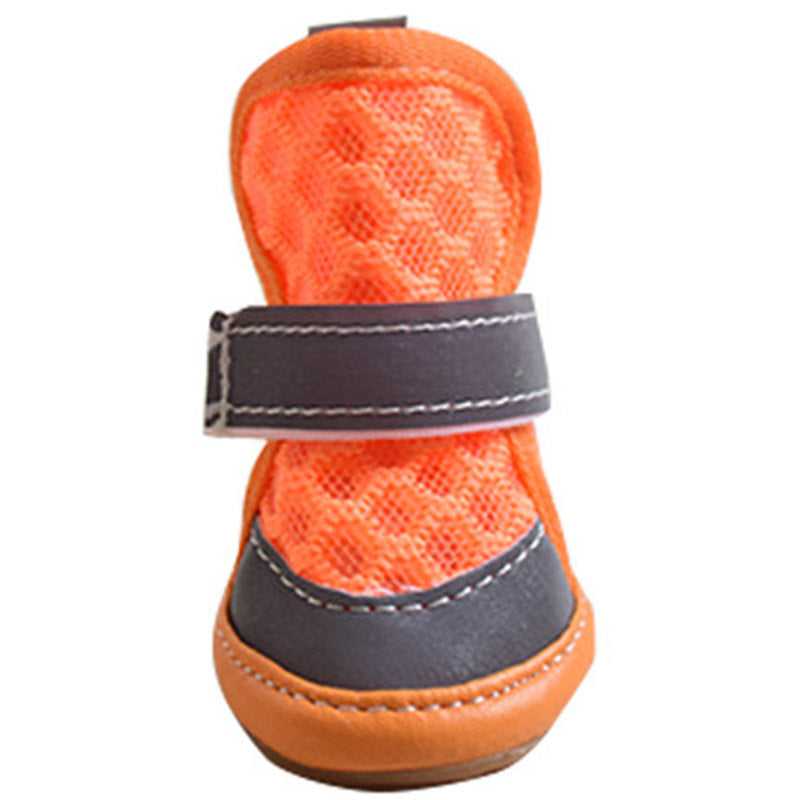 Orange pet shoe with a gray strap on a white background. Bishop x
