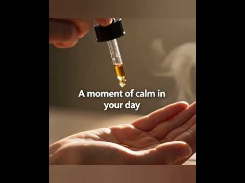 Woman working at her office desk, pausing to take Reishi Calm Drops from a glass dropper bottle, creating a calm and focused work‑day moment. Bishop Elite Supplements 