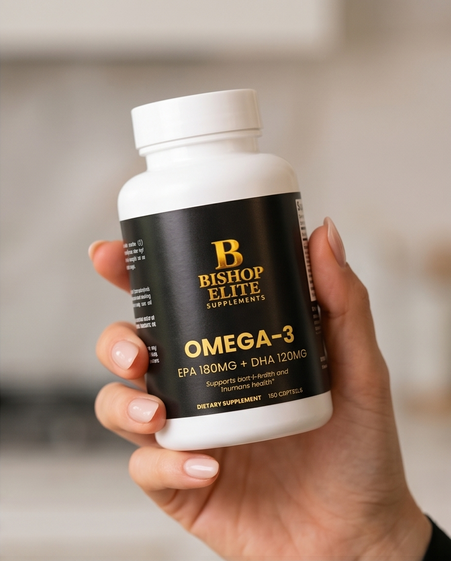 Hand holding a bottle of Bishop Elite Omega-3 supplements with a blurred background.  Bishop Elite Supplements 
