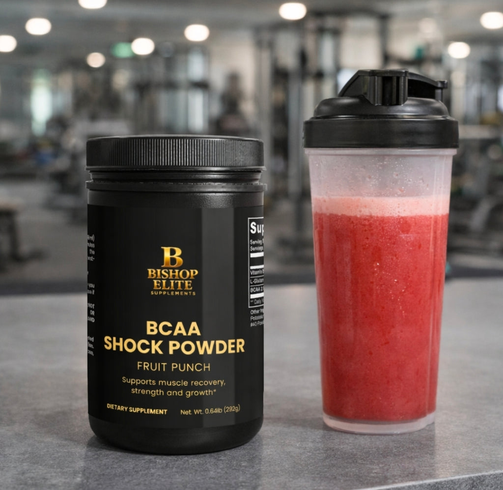 Bishop Elite BCAA Shock Powder container and a shaker with a red supplement mix in a gym setting. Bishop Elite Supplements 
