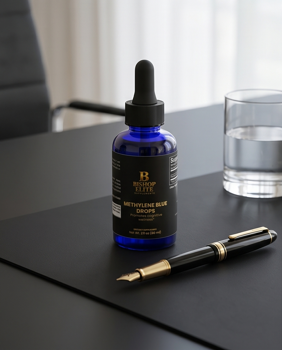 Bottle of Methylene Blue Drops with a dropper on a table next to a pen and glass of water. Bishop Elite Supplements 
