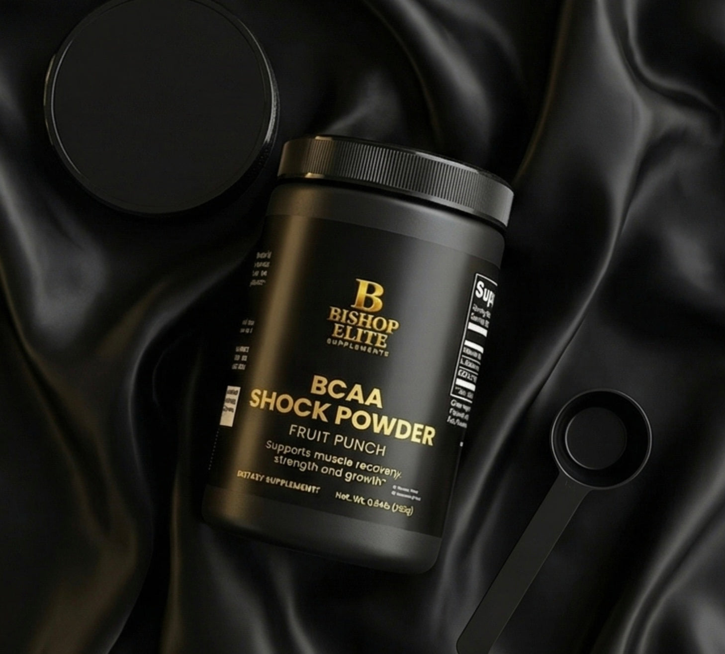 Black container of Bishop Elite BCAA Shock Powder on black fabric.  Bishop Elite Supplements 