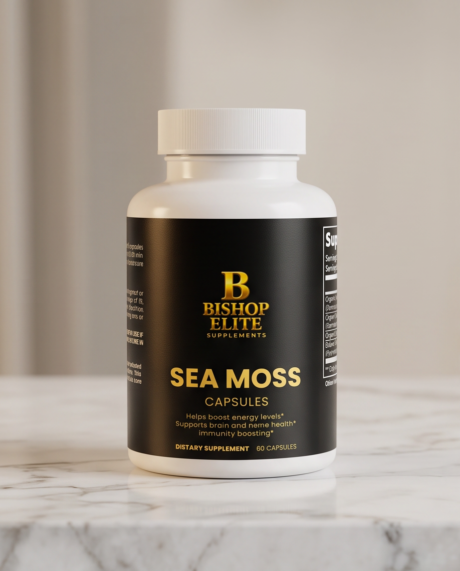 A white bottle of Bishop Elite Supplements Sea Moss Capsules with a black label and gold lettering, resting on a white marble surface against a soft beige background. Bishop Elite Supplements 