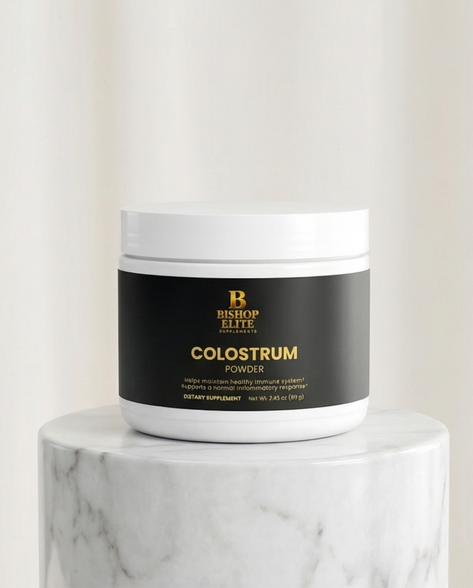 Jar of Bishop Elite Colostrum Powder on a marble surface with a white background. Bishop Elite Supplements 